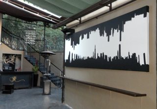 Sound reverberating from the massive concrete walls of the R Lounge patio in LA is subdued with QuietFiber, wrapped in urban chic fabric and hung strategically to absorb sound. Sound reverberating from the massive concrete walls of the R Lounge patio in LA is subdued with QuietFiber, wrapped in urban chic fabric and hung strategically to absorb sound.
