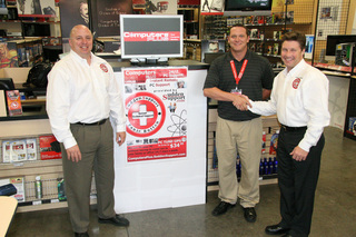 Matt Mercurio seals the deal with Westport Road General Manager of Computers Plus, Riley Rose, while SuddenSupport Partner Kevin Halbleib looks on.