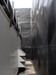 A 24 foot tall, three sided Acoustifence barrier was installed around the industrial chiller on an existing chain link fence. 