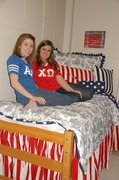 Students enjoying DSD bedding in a model room at Samford University