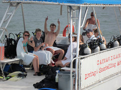 Aboard an Ocean Frontiers dive boat and doing a job they love are young ocean heroes.