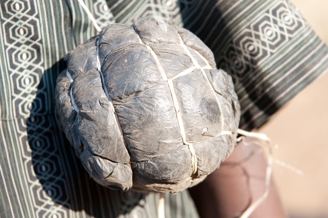 A child in Zambia shows us his "soccer ball," which is made out of trash bags and twine.<br />
