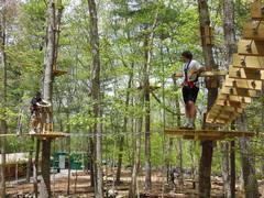 Two friends climb together at The Adventure Park at Storrs. Climbing with friends or groups is good for mutual support and team-building. (photo by Anthony Wellman)