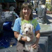Christine Mason, Licensed Real Estate Professional at Preferred Timeshare Resales, with her dog, Maya