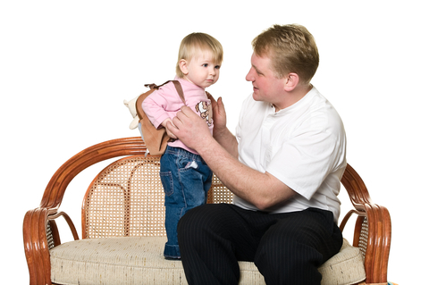 Dad preparing child for the new school year