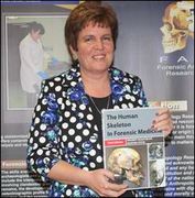 Prof Maryna Steyn with a recently published third edition of The Human Skeleton in Forensic Medicine