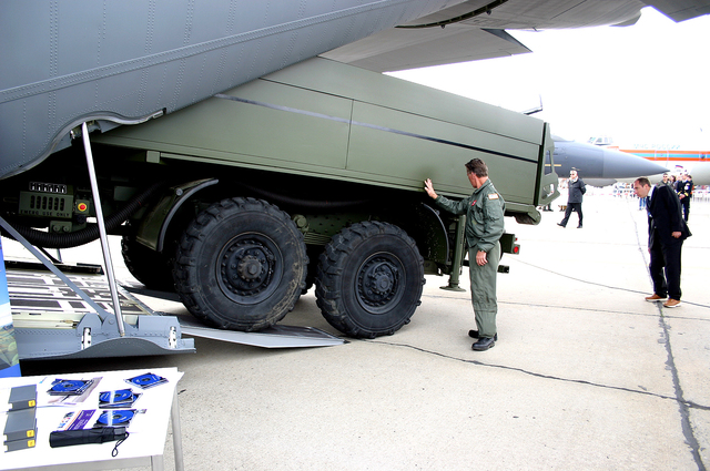 A model of the Medium Extended Air Defense System gets loaded onto a C-130J Hercules aircraft.