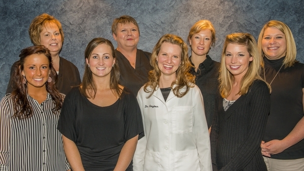 Dr. Sarah Clayton (center) volunteers with local free clinic to offer dental services to those in-need. 