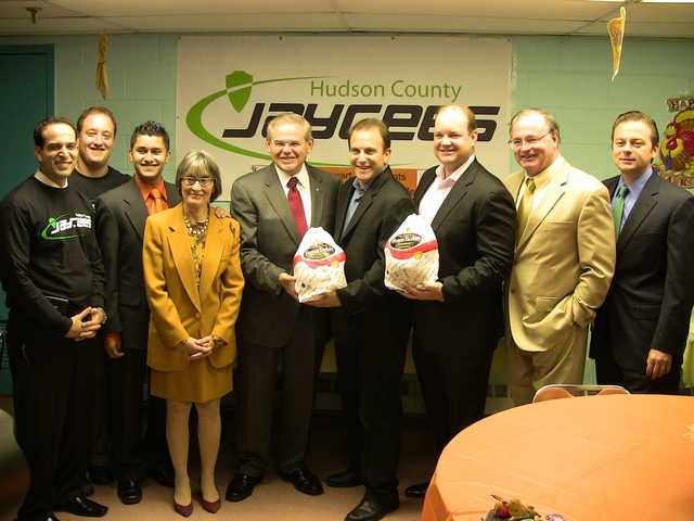 Senator Robert Menendez, ACMG CEOs Thomas Shipley and Andrew Surwilo, Mayor Healy, Housing Authority officials and members of the Jaycees gear up to give out 350 turkeys to local residents