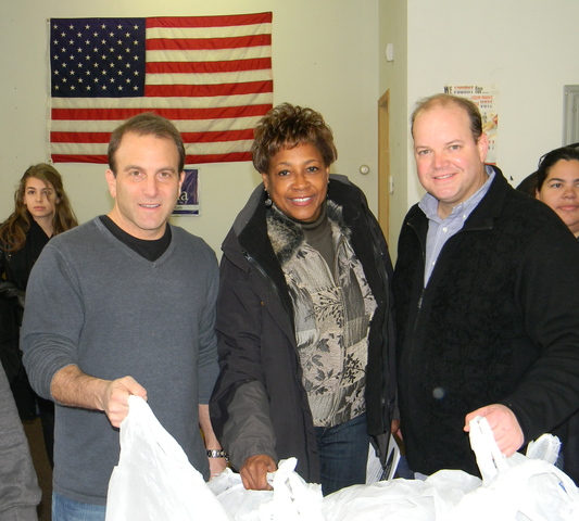 Atlantic Coast Media Group CEOs Thomas Shipley and Andrew Surwilo and State Senator Sandra Bolden Cunningham ready to hand out hundreds of turkeys in Jersey City