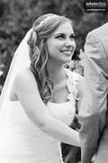 Candid photo of bride during ceremony.  At Green Bay Botanical Garden in Green Bay, Wisconsin.