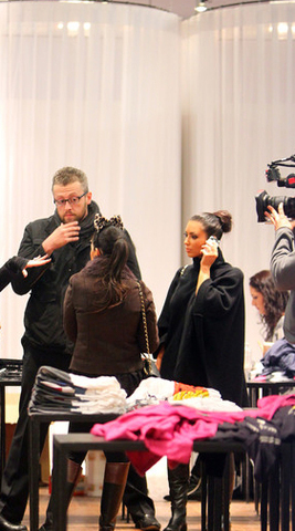 Designer Geoffrey Okshteyn of Studios GO, Inc. with Kourtney and Kim Kardashian in the boutique with the Luminette® Privacy Sheers from Hunter Douglas on the changing rooms behind them.  