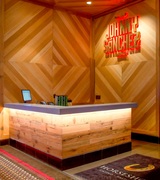 The Reclaimed Sinker Cypress panels that adorn the Johnny Sanchez restaurant feature an impressive pattern said to inspire a traditional "ojo de Dios" or Eye of God. 
