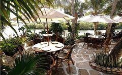 Waterfront dining is peaceful and relaxing, with Acoustifence noise deadening material strategically concealed within the property's lush tropical landscaping.