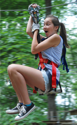 Zip lines are just part of the fun at The Adventure Park at Long Island. Judging from this climber's expression...a LOT of fun! (Photo: Outdoor Ventures)