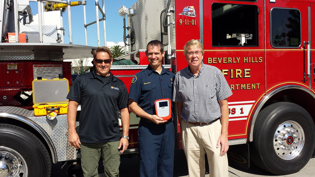 The Beverly Hills Fire Department received a HazSim System through the Corporate Grant Program.  L-R: HazSim CEO, Phil Ambrose, Firefighter, Manny Rosales, E&B Natural Resources Rep, Paul Langland