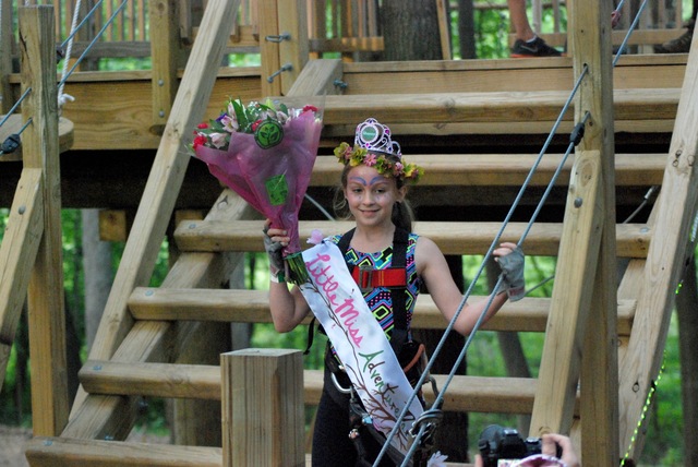 Sabrina Loftus, Lil' Miss Adventure Park 2015, wearing both her tiara and winner's headpiece, on the steps of the starting platform at The Adventure Park at West Bloomfield.