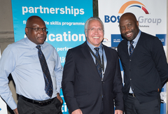 BOSASA Group CEO, Gavin Watson standing between Executive directors Joe Gumede and Papa Leshabane.