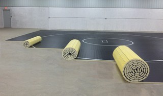 SportsGraphics introduces a Revolutionary New Line of Wrestling Mats: Roll Out Mats