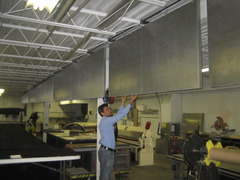 Quiet-Cloud panels hung vertically in an industrial warehouse