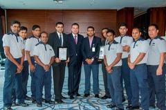 Mr. Suraj Veetil from Quality Registrar Systems presents the certificates to Mr. Stefan Gaessler, General Manager of Hyatt Capital Gate Abu Dhabi and his Team.