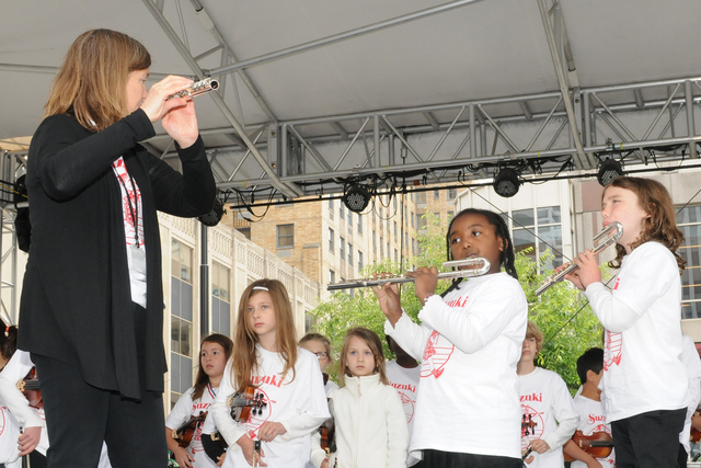 Students enrolled in the Suzuki Cooperative of Cincinnati Public Schools perform at a concert.