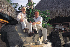 John Wadsworth and Bryant Wadsworth together in Tahiti holding the noni plant leaf.  