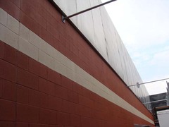 The top 10 feet of the adjacent Festival Foods warehouse-sized store is treated with QuietFiber to prevent sound reflection over the top of the chiller barrier.
