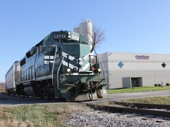 A train car filled with plastic polymers leaves the loading area on the north side of the building. Rail siding is one of Lastique's capabilities and they can fit 22 rail cars on two tracks. 