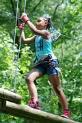 This young climber's expression shows that climbing is not only fun but builds self-confidence. (Photo: Outdoor Ventures)