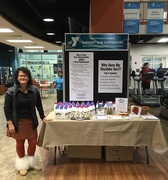 Dr. Grossfeld is pictured at the Y at Norton Commons standing next to a table she set up through her private practice, Orthopaedic Specialists, to promote orthopedic health and awareness. 