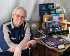 Travis Pike manning the New Playwrights Foundation's booth in the 2017 Los Angeles Times Festival of Books