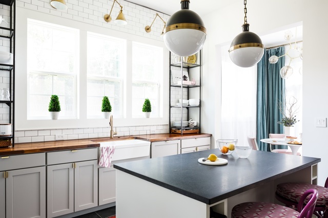 Bethany Adams, Certified Interior Designer, designed this entire historic home in Old Louisville, KY. Here you can see her open kitchen featuring a farmhouse sink and butcher block counter tops.