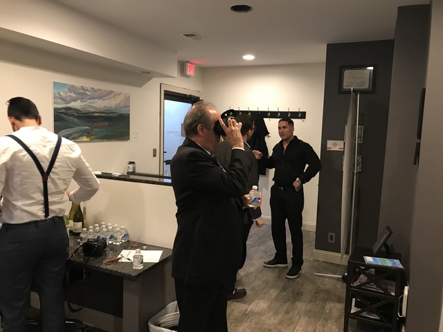 Guests view the VR Center at Cornerstone Realty's Staten Island Office.