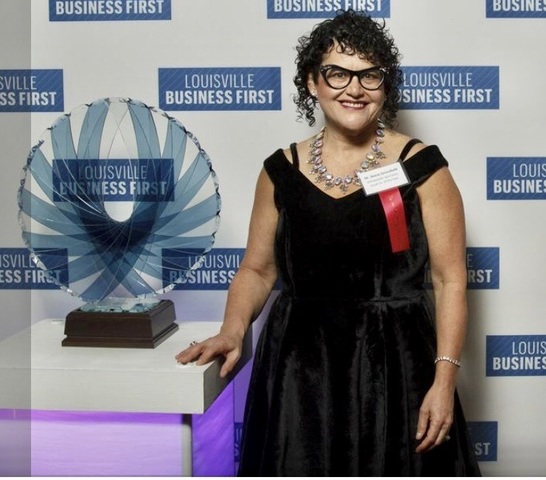 Orthopaedic Specialists PLLC practice owner Dr. Stacie Grossfeld wins 2017 Business of the Year Award from Business First Louisville. Photo credit: William DeShazer