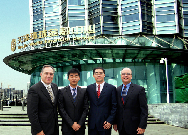 Leisure Quest's Mark Driscoll and Ted King pictured with LQI China's General Manager Michael Xue and Marketing Director Josh Du in front of the Company's new China Headquarters.