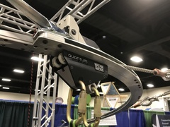 The Quantum trolley as it rounds a corner of the System's demonstration cable and track set up at the Ropes Park Equipment Booth at the ACCT Conference.