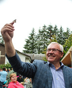 Mayor Henry Braun releases a butterfly into the garden.