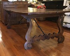 This exceptional 8 ft. gnarled pine table is one of the beautiful furniture pieces available at European Splendor in Louisville, Kentucky. 