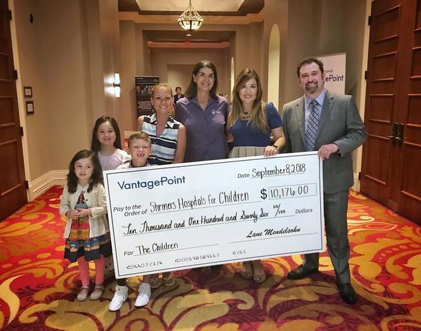 $10,000 giant check held by President Lane Mendelsohn presented to Shriners Hospitals for Children