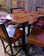 River City Wood Design created a custom-made wooden bar table out of a live edge cut of Walnut Burl for Troll Pub in Louisville, Kentucky. 