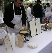 A chef dips into freshly prepared fondue at the Taste of the Tetons Event