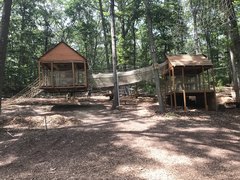 The Adventure Playground includes some unusual features not found at the typical playground. The treehouse on the left is suspended and sways a bit-just enough for fun.