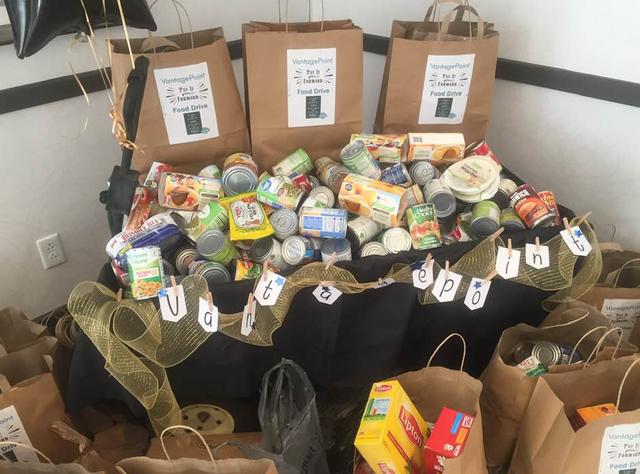 Vantagepoint AI donates canned goods for 40th anniversary.