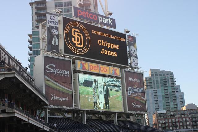 Chipper Jones Receiving His Custom South Coast Surfboard from the San Diego Padres