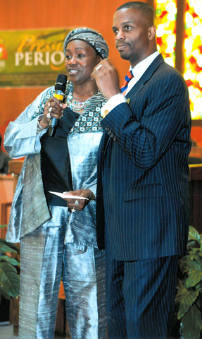 (L) Hattie Smith-Miles presented with an honorary donation for the House of Acts by (R) Rev. Dante Quick of Friendship Missionary Baptist Church in Vallejo, Calif.