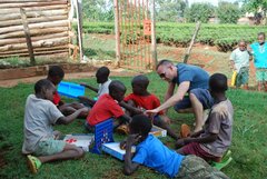 James Frost playing games with the boys from the safe house in Kenya